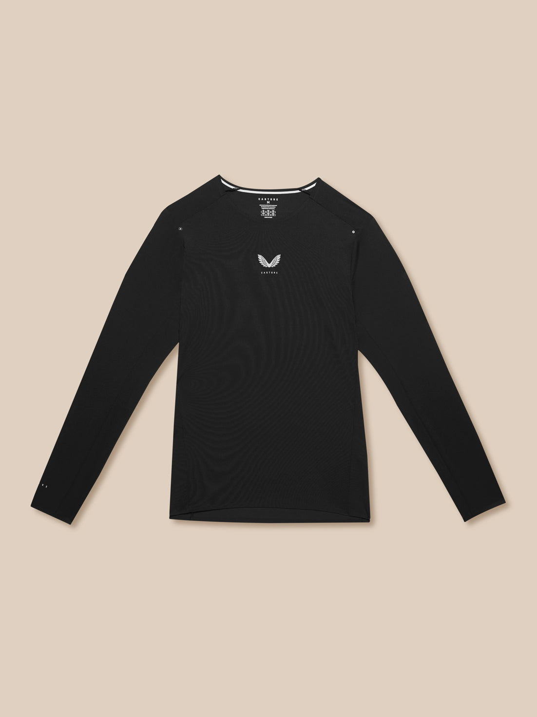 Flat lay of black Zone Training T-Shirt on beige background with long sleeves and chest logo