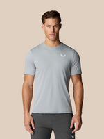 Man wearing light grey Flow Training T Shirt with honeycomb pattern and small Castore logo on the chest