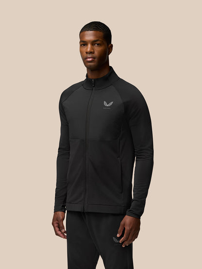 Man wearing Flow Training Jacket in black with full zip and Castore logo on chest