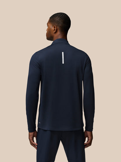 Back view of navy Flow Quarter Zip Sweater Top showing Castore branding down the center back