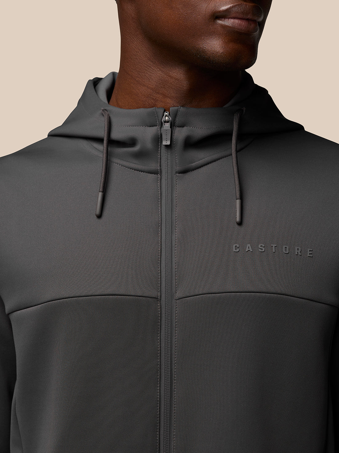 Close-up of charcoal Flex Lifestyle Full Zip jacket showing hood with drawcord and front zipper.
