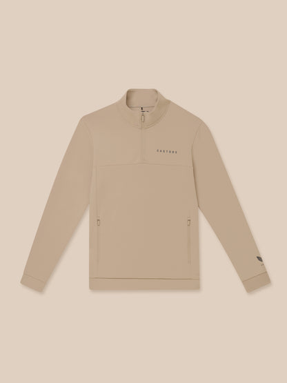 Close up of beige Flex Lifestyle 1/4 Zip showing chest Castore wordmark and quarter zip detail