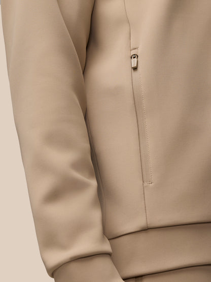 Beige Flex Lifestyle center front quarter zip jacket with visible zip pocket details