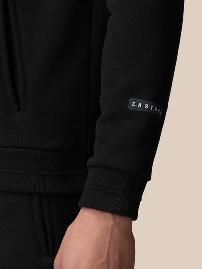 Close-up of the black hoodie sleeve featuring CASTORE label.