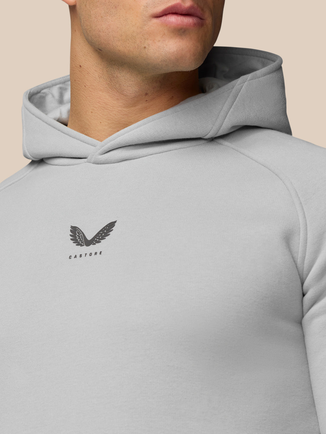 Close view of grey Adapt Fleece Hoodie chest with Castore logo