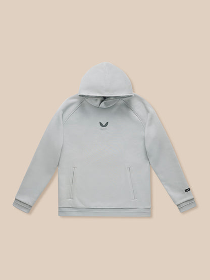 Adapt Fleece Hoodie in grey with front pockets and small logo on beige backdrop