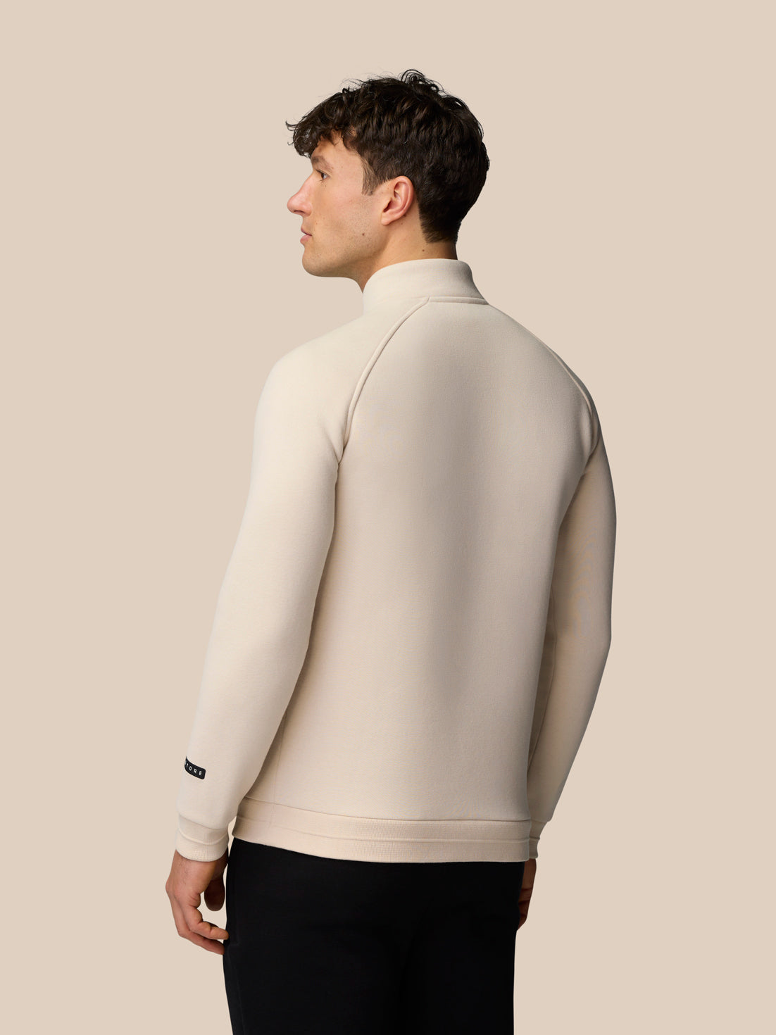 Adapt Fleece Quarter Zip Stone/Gunmetal back view on a model showing high collar and ribbed hem