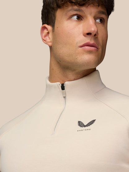 Close up of male model in Adapt Fleece Quarter Zip Stone Gunmetal showing zip collar and chest logo