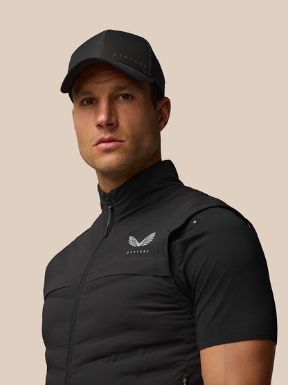 Male model in black Zone Training Gilet shown from the front with zipped closure and Castore logo on the chest