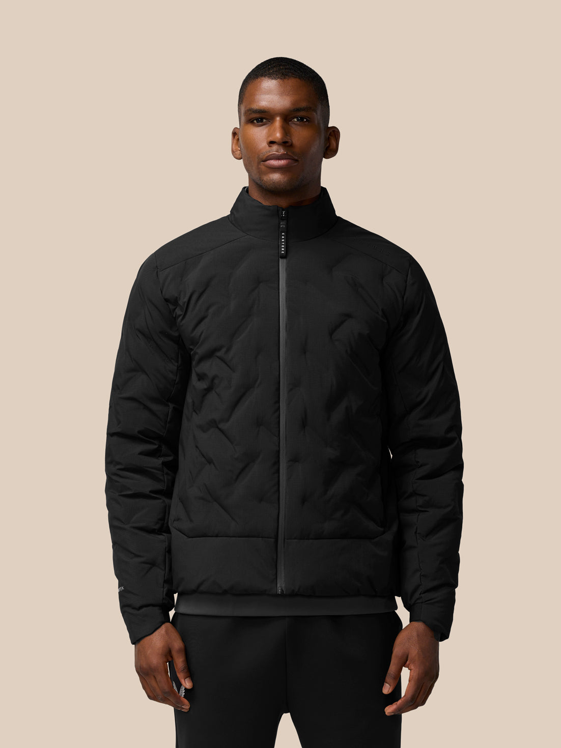 Model wearing black Padded Jacket with stand collar full front zip and zip pockets
