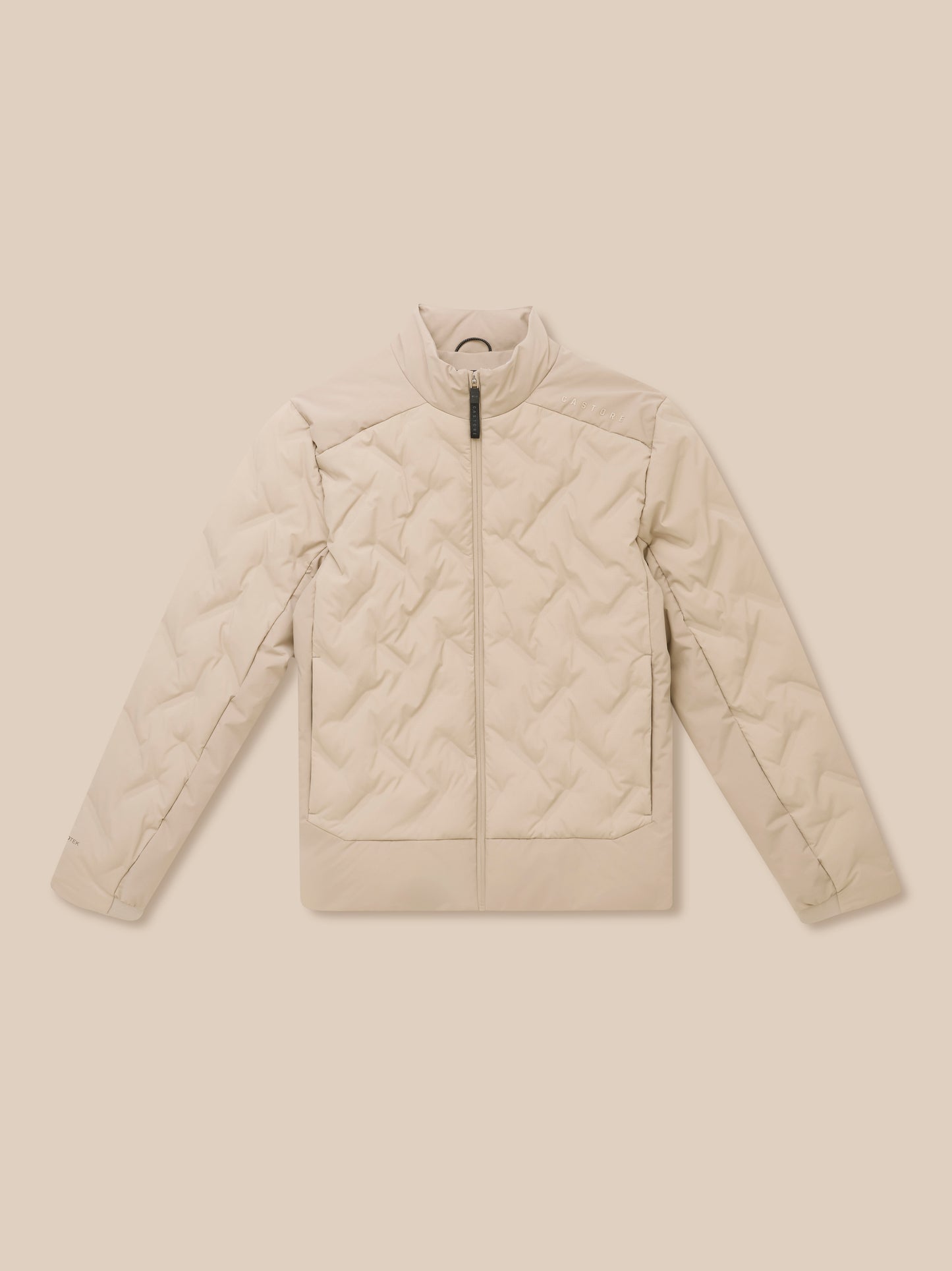 Mushroom colored padded jacket close-up focusing on chest area with front zipper and Castore logo.