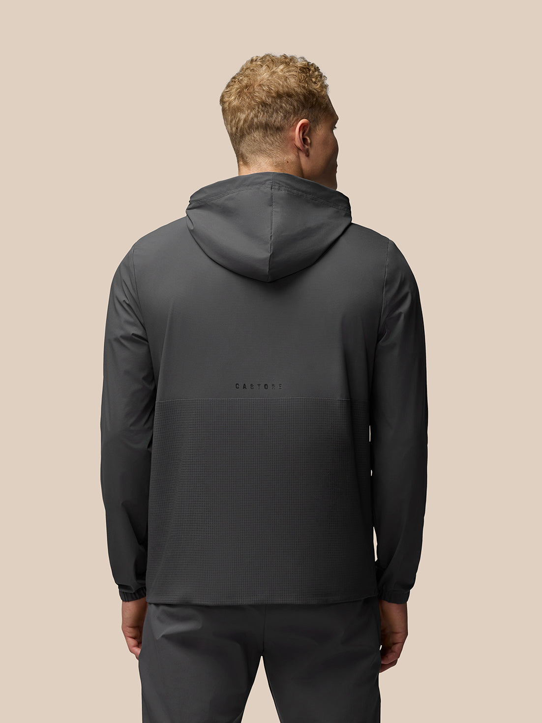 Back view of grey Flex Hoodie showing hood and subtle Castore branding across the back