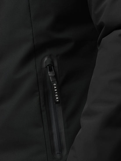 Close-up of black longline wadded jacket zipper and fabric texture with Castore branding on the pull
