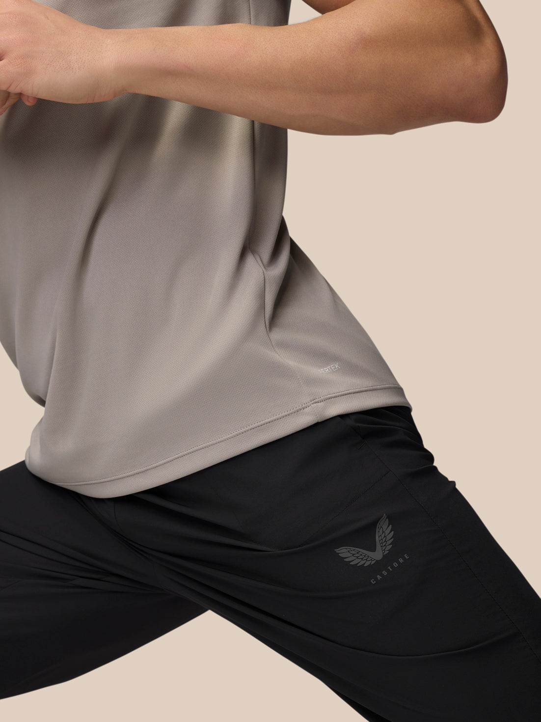 Close-up of the waistband area on black Adapt Training Joggers showing ProTek label and moisture-wicking fabric