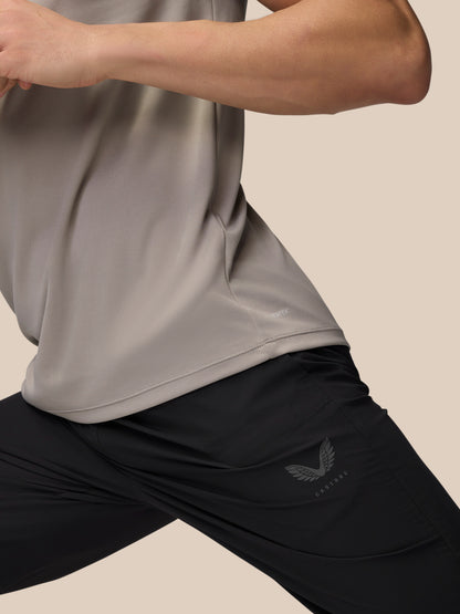 Close-up of the waistband area on black Adapt Training Joggers showing ProTek label and moisture-wicking fabric