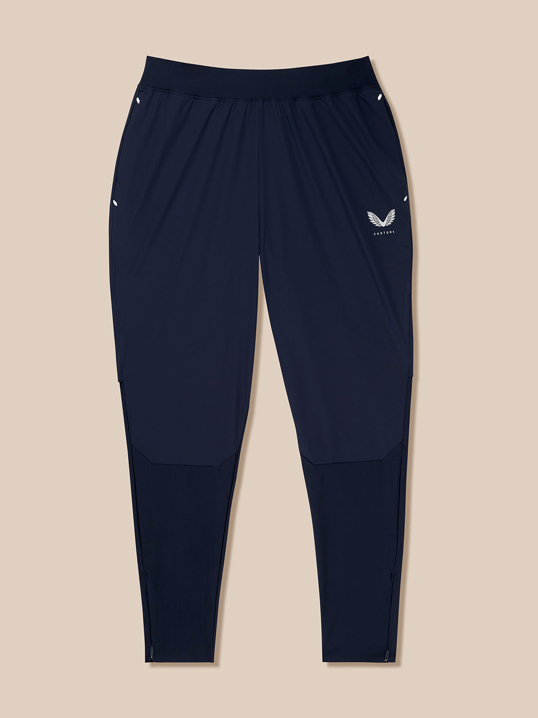 Back view of midnight navy Zone Training Trousers with a white Castore logo on the hip and reflective details