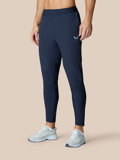 Model wearing Zone Training Trousers Midnight Navy with a tapered leg and drawcord waist