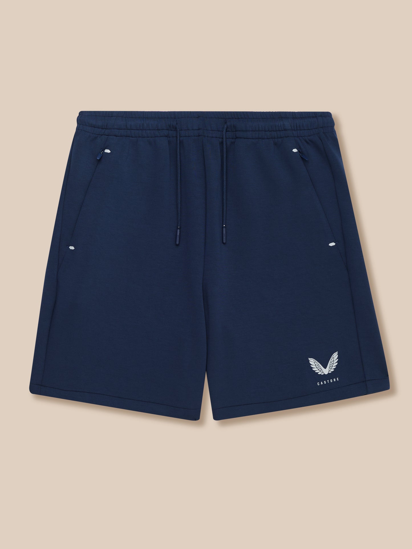 Navy Travel Lifestyle Shorts with drawcord waistband concealed zip pockets and Castore logo at bottom right.