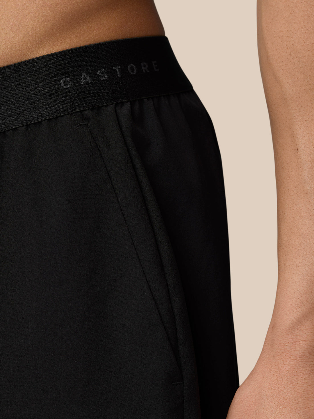 Close-up of black elastic waistband with Castore branding on the back of the shorts