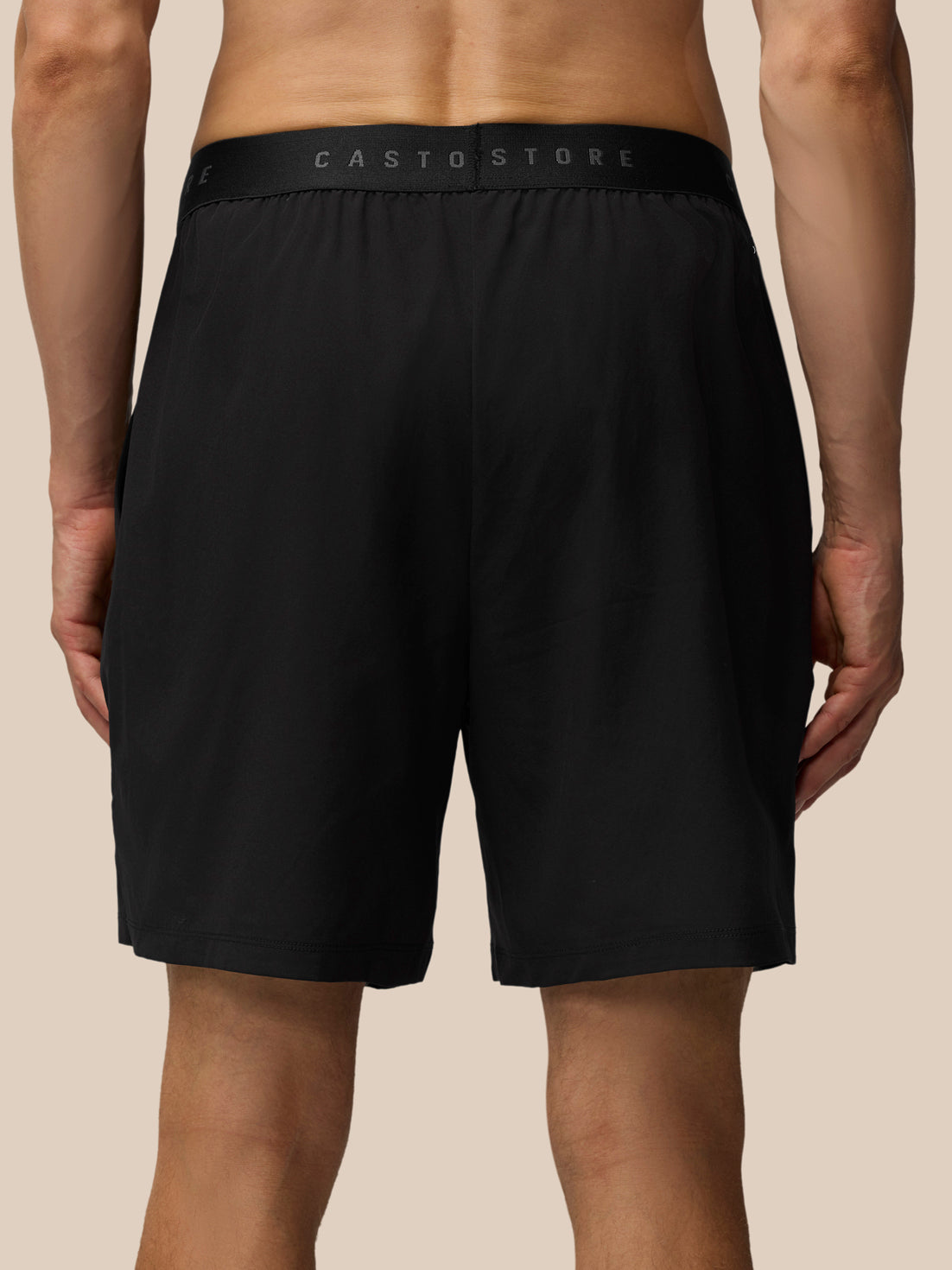 Back view of black Adapt Training Shorts showing a branded CASTORE waistband
