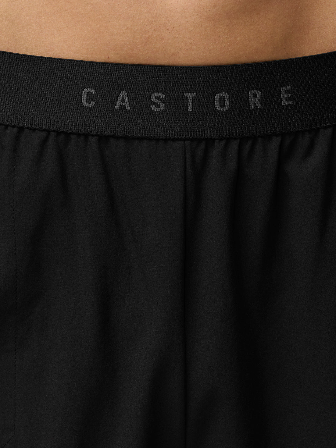 Close up of the black CASTORE waistband on Adapt Training Shorts