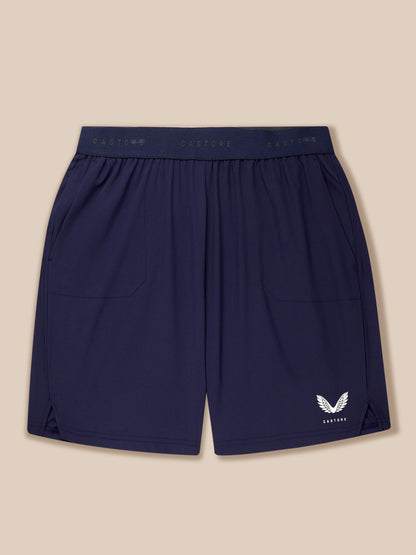 Back view of navy Adapt Training Shorts with elastic waistband and Castore logo on the lower right leg.