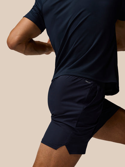 Close-up of navy Adapt Training Shorts showing Protek label at the back waistband