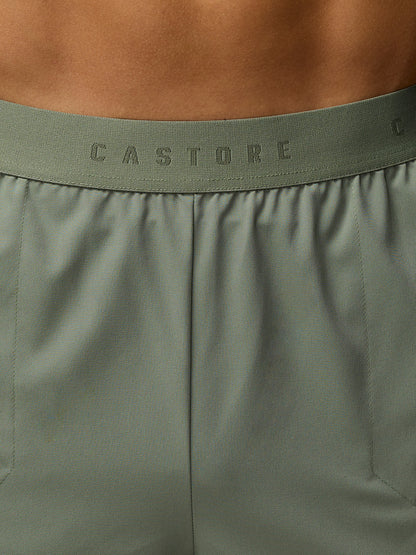 Close-up of olive green waistband with CASTORE branding on shorts