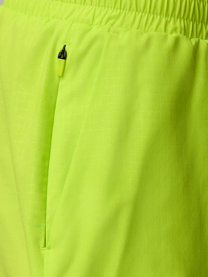 Close-up of a lime green zip pocket on Adapt Swim Shorts fabric