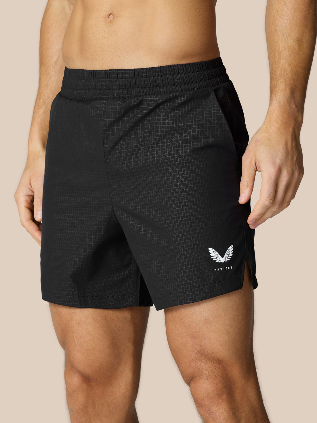 Adapt Swim Shorts in black with a subtle grid pattern and white Castore logo on the leg