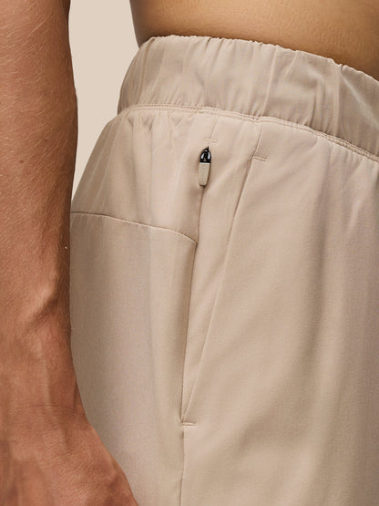 Beige Flow 2-in-1 shorts close up of concealed zip pocket at the waistband