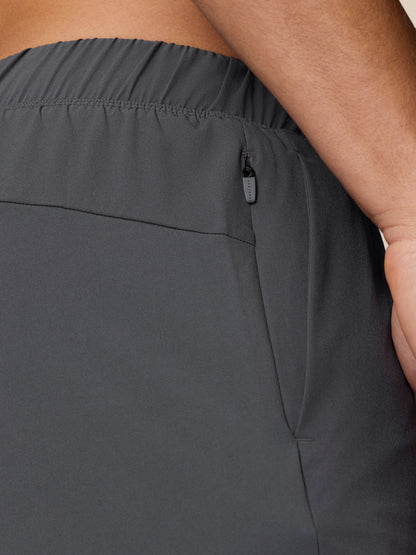 Back waist close up showing a small zip pocket on Flow Training 2-In-1 shorts