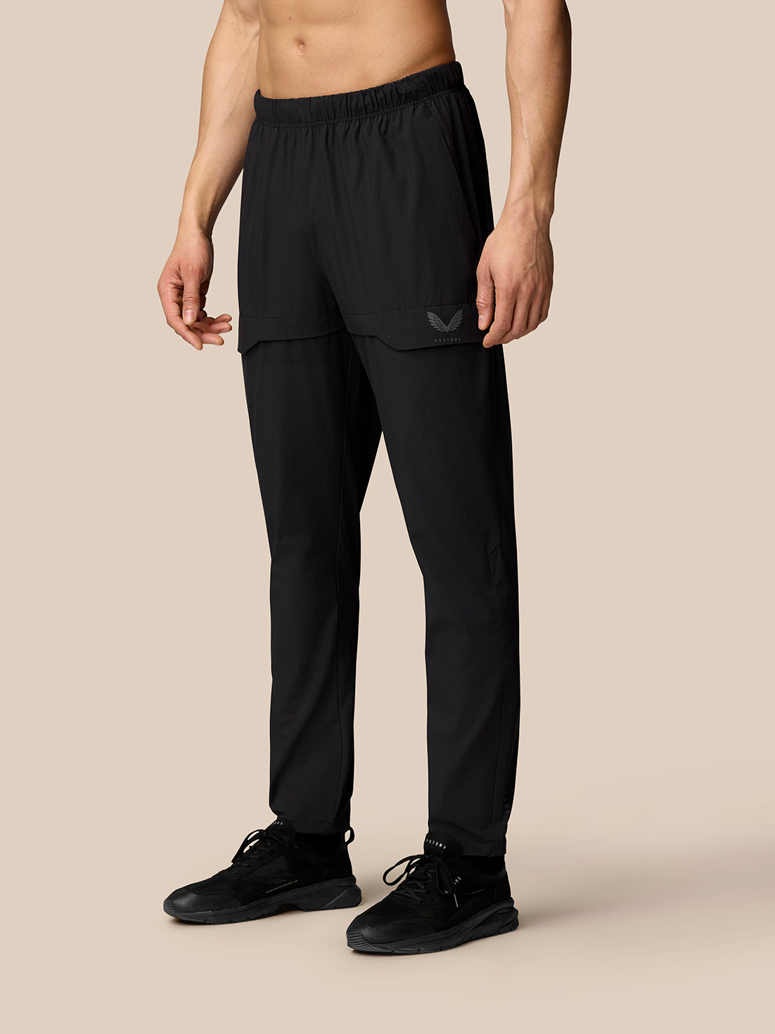 Front view of black Flex Lifestyle Cargo Trousers with thigh cargo pocket and adjustable cuff toggles