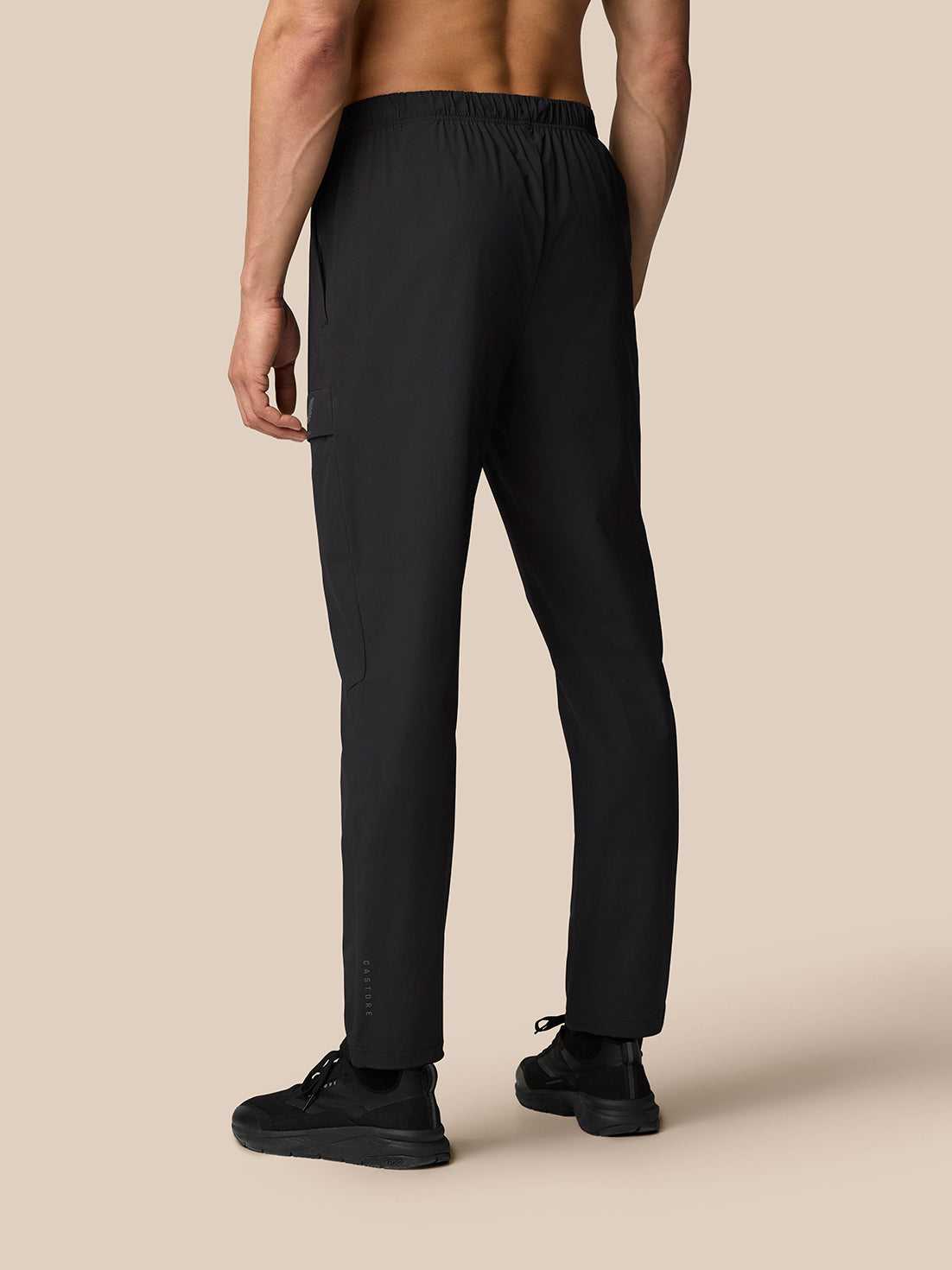 Rear view of black Flex Lifestyle Cargo Trousers with elastic waistband and straight leg cut