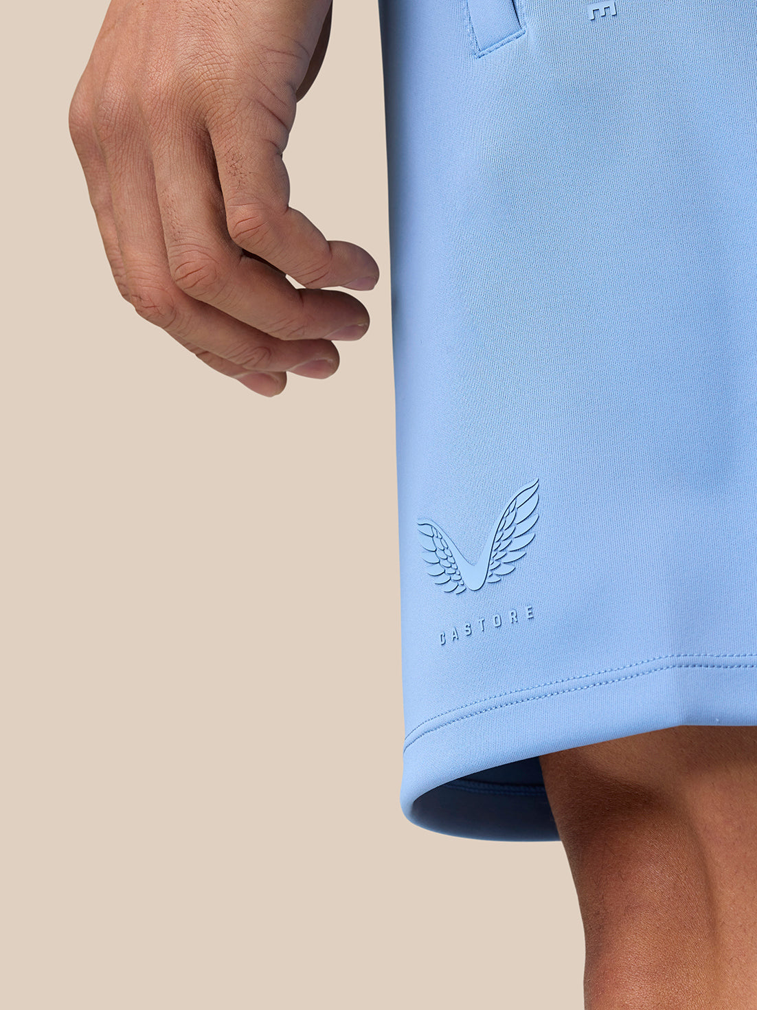 Male model wearing a sky blue Flex Lifestyle top and matching shorts for activewear