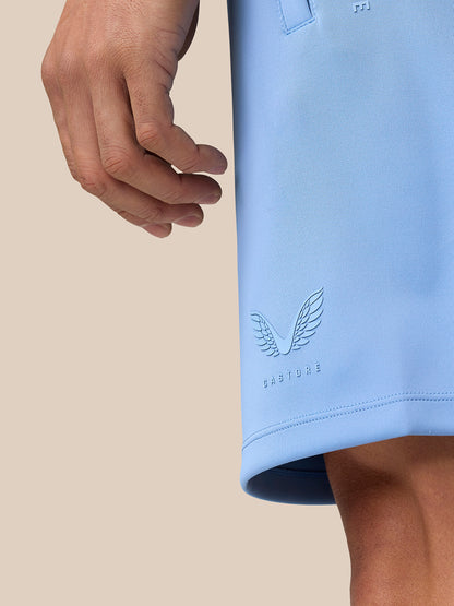 Male model wearing a sky blue Flex Lifestyle top and matching shorts for activewear
