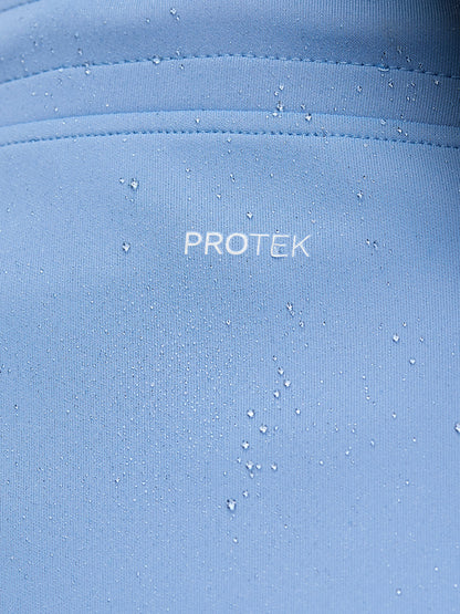 Close-up of sky blue Flex Shorts ProTek fabric with water droplets and seam details