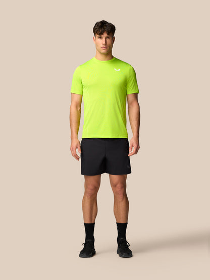 Male model wearing black Apex Training Shorts with zipped side pockets and an elastic drawcord waistband.