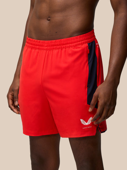 Close up of red Apex Training Shorts waistband with navy side panel
