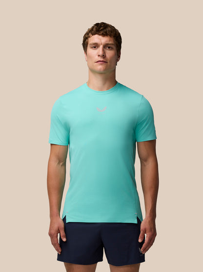 Man wearing light aqua Zone Training T-Shirt with a small chest logo and navy shorts.