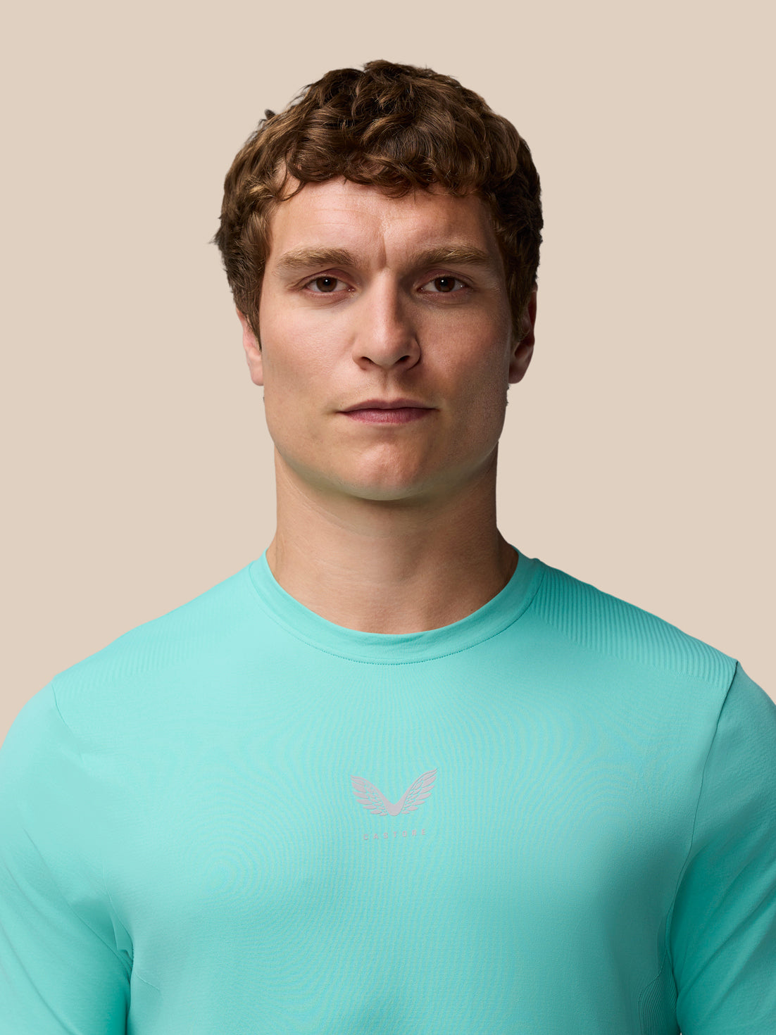 Male model wearing Zone Training T-Shirt in light aqua, front view.