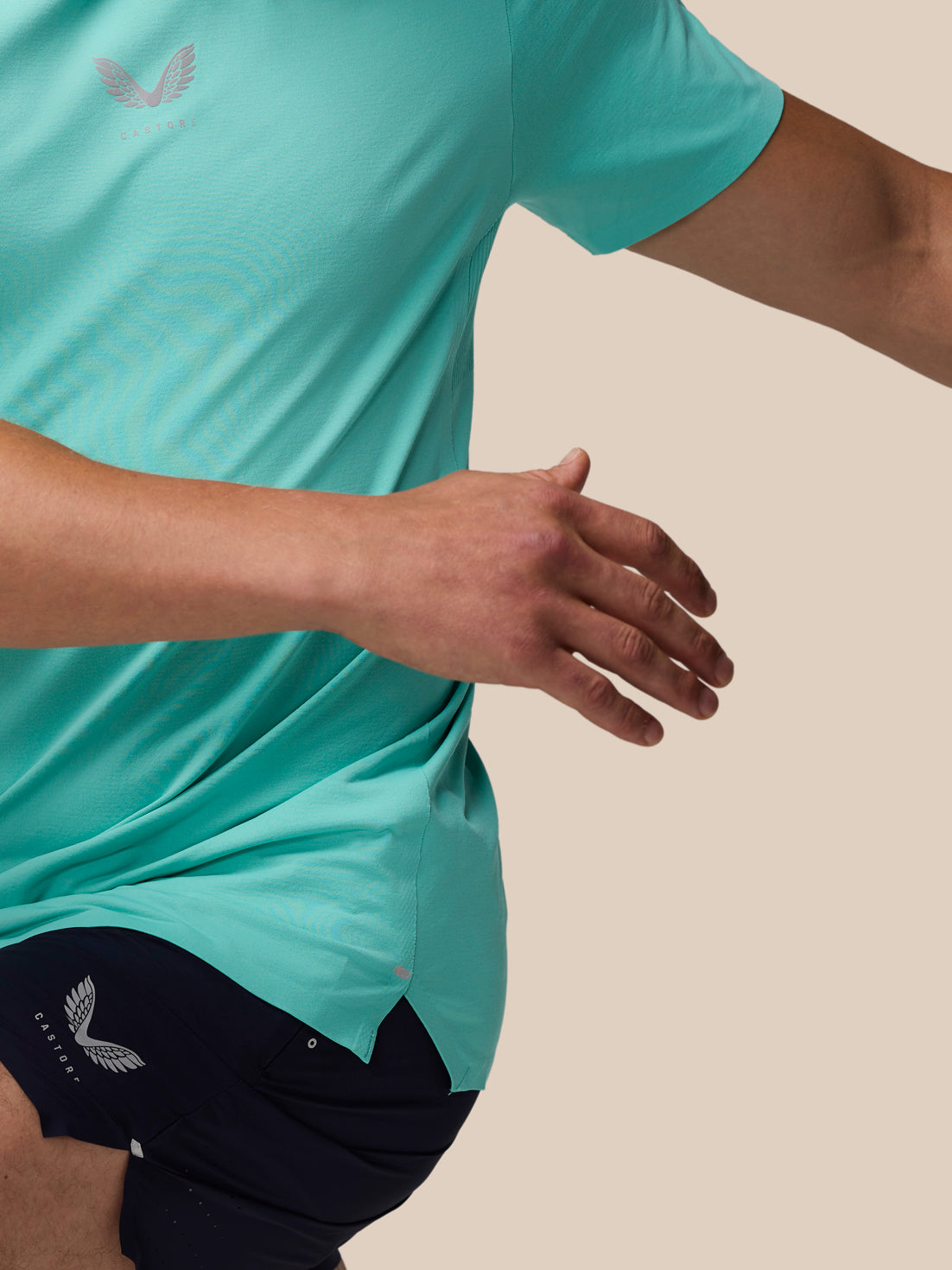 Zone Training T-Shirt in Light Aqua worn by a model, front view with logo on the chest and curved hem.