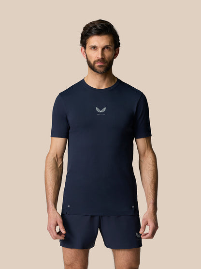 Male model in Zone Training T-Shirt Midnight Navy with chest logo and matching shorts, full front view