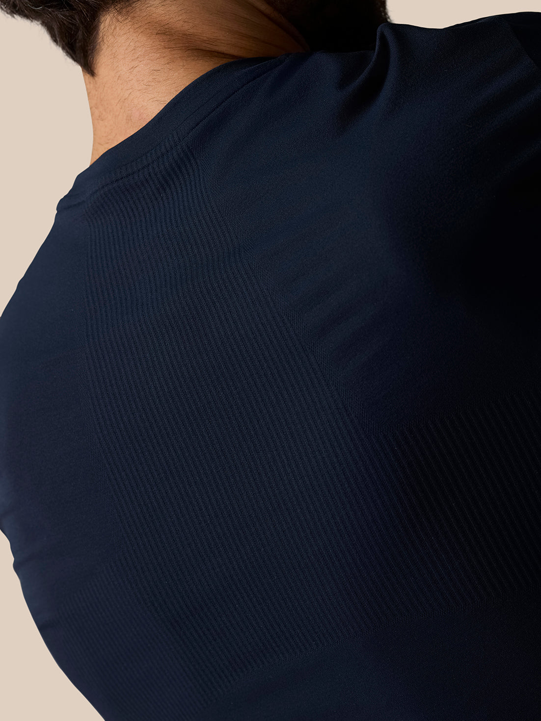 Close-up of Zone Training T-Shirt Midnight Navy showing ribbed panel details on the back shoulder
