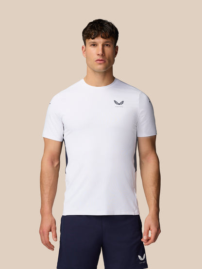 Front view of a male model wearing a white Apex Training T-Shirt with a crew neck and navy shorts.