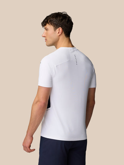 Back view of a male model in a white Apex Training T-Shirt showing vertical Castore branding along the upper back.