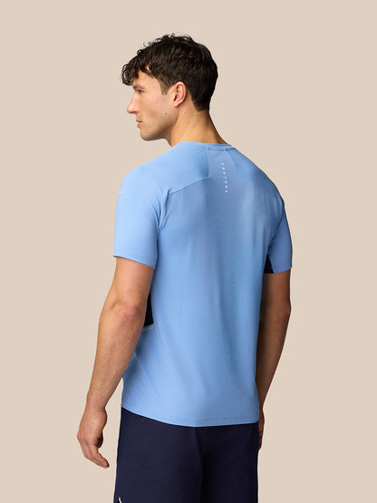 Back view of a model wearing Sky Blue Apex Training T-Shirt with vertical branding on the upper back