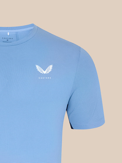 Chest area of sky blue Majesticks T-Shirt featuring a white Castore wing logo