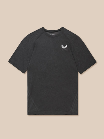 Close-up of a model wearing a black Flow Training T Shirt with a small white chest logo