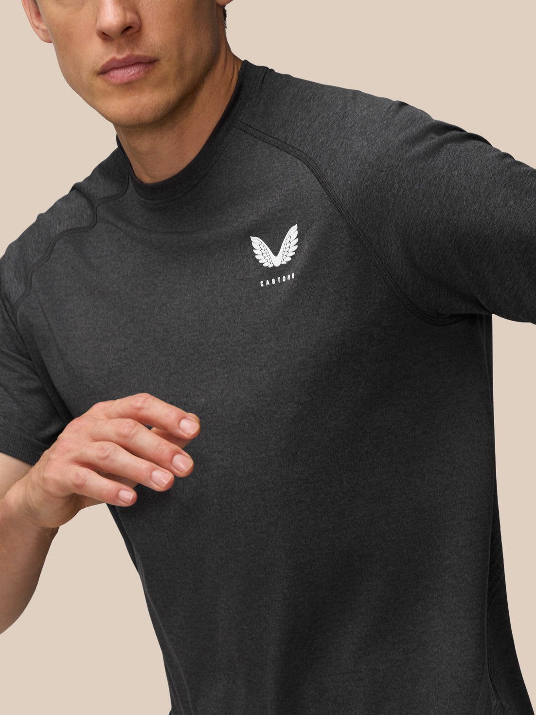 Close-up of chest area on Flow Training T-Shirt in black with small left chest logo
